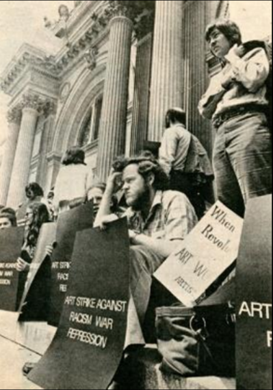 crowd sitting in front of government